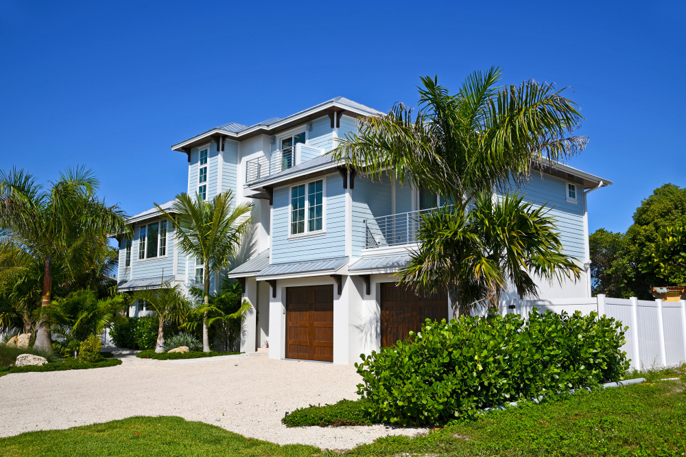 A blue secure beach house with a secure front door