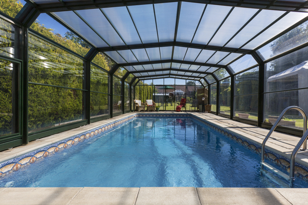 A full pool enclosure in the sunlight